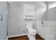 Bathroom featuring a shower, toilet, bathtub, and gray walls at 2467 Hawk Ridge Dr, Gastonia, NC 28056