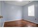 This bedroom features beautiful hardwood floors and natural light from the window at 2467 Hawk Ridge Dr, Gastonia, NC 28056