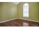 This bedroom features beautiful hardwood floors, neutral walls and a window at 2467 Hawk Ridge Dr, Gastonia, NC 28056
