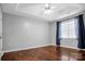 Spacious main bedroom featuring hardwood floors, ceiling fan, and lots of natural light at 2467 Hawk Ridge Dr, Gastonia, NC 28056