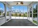 Relax in the screened in porch offering views of the lush backyard and neighborhood at 2467 Hawk Ridge Dr, Gastonia, NC 28056