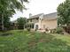 Well-maintained backyard featuring a patio area, lush lawn, and partial fencing, offering outdoor living at 2848 Huckleberry Hill Dr, Fort Mill, SC 29715