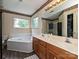 Bathroom featuring double vanity, and large soaking tub at 2848 Huckleberry Hill Dr, Fort Mill, SC 29715
