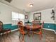 Dining room with a large table, stylish rug, bright window, and sophisticated decor accents at 2848 Huckleberry Hill Dr, Fort Mill, SC 29715
