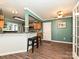 The dining room features wood floors, open to the kitchen and natural light at 2848 Huckleberry Hill Dr, Fort Mill, SC 29715