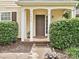 Inviting front entry with brick-lined walkway, charming shrubs, and prominent house number display at 2848 Huckleberry Hill Dr, Fort Mill, SC 29715