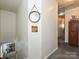 Bright hallway with carpet, decorated with a mirror and small cabinet perfect for adding character to the home at 2848 Huckleberry Hill Dr, Fort Mill, SC 29715
