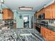 A modern kitchen with stainless steel appliances, tile backsplash, and stone countertops at 2848 Huckleberry Hill Dr, Fort Mill, SC 29715
