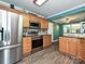 Bright kitchen with stainless steel appliances and natural wood cabinets at 2848 Huckleberry Hill Dr, Fort Mill, SC 29715