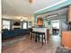 Open living space with counter seating, a modern kitchen, and a view into the living room at 2848 Huckleberry Hill Dr, Fort Mill, SC 29715