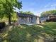 Backyard featuring a small deck, patio area, and lush greenery offering space to relax at 3133 Amay James Ave, Charlotte, NC 28208