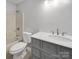 Bathroom features a vanity with marble countertop and a tub/shower combo at 3133 Amay James Ave, Charlotte, NC 28208