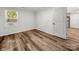 This bedroom has wood floors and a neutral color scheme, with plenty of light coming in at 3133 Amay James Ave, Charlotte, NC 28208