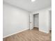Bedroom with wood flooring and an open closet at 3133 Amay James Ave, Charlotte, NC 28208