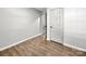 Bedroom showcases wood-look flooring, white trim, and neutral walls at 3133 Amay James Ave, Charlotte, NC 28208