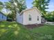 Charming home exterior features a well-maintained lawn, trimmed garden bed, and siding at 3133 Amay James Ave, Charlotte, NC 28208
