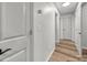 Hallway is freshly painted with wood-look flooring at 3133 Amay James Ave, Charlotte, NC 28208