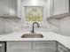Close up of sink and modern countertops in a remodeled kitchen at 3133 Amay James Ave, Charlotte, NC 28208