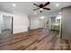 Spacious living room with eat-in kitchen, natural light and new flooring at 3133 Amay James Ave, Charlotte, NC 28208