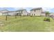 Fenced backyard featuring large lawn, a fire pit and perimeter plantings at 3304 Saddlebrook Dr, Midland, NC 28107