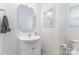 Small bathroom with white vanity, octagon mirror and decor at 3304 Saddlebrook Dr, Midland, NC 28107