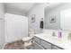 Bathroom with gray vanity, a single sink, and a shower with curtain at 3304 Saddlebrook Dr, Midland, NC 28107