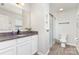 Bathroom with granite countertop, shower with sliding glass door, and white subway tiles at 3304 Saddlebrook Dr, Midland, NC 28107