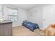 Bedroom with a twin bed, neutral colored carpet and a window for natural light at 3304 Saddlebrook Dr, Midland, NC 28107
