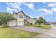Attractive home with a spacious driveway, two-car garage, and landscaped lawn on a sunny day at 3304 Saddlebrook Dr, Midland, NC 28107