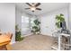 Office space with a large window, plants, and a workspace at 3304 Saddlebrook Dr, Midland, NC 28107