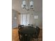 Classic dining room featuring a traditional chandelier, wooden table set perfect for gatherings and meals at 3944 Town Center Rd, Harrisburg, NC 28075