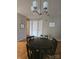 Classic dining room featuring a traditional chandelier, wooden table set perfect for gatherings and meals at 3944 Town Center Rd, Harrisburg, NC 28075