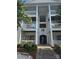 Inviting condominium entrance with multiple levels and manicured landscaping, offering a warm welcome at 3944 Town Center Rd, Harrisburg, NC 28075