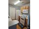 Functional kitchen equipped with white appliances and wood cabinetry, ready for your culinary creations at 3944 Town Center Rd, Harrisburg, NC 28075