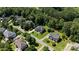 Aerial view of the neighborhood showcasing beautiful homes and mature trees at 3963 Harmattan Dr, Denver, NC 28037