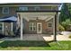 Outdoor patio includes ample seating space, ceiling fan and trimmed shrubbery at 3963 Harmattan Dr, Denver, NC 28037
