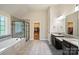 Bathroom featuring a soaking tub, glass shower, and granite countertop dual sinks at 3963 Harmattan Dr, Denver, NC 28037