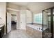 Bathroom featuring a soaking tub, a glass shower, and an entryway to the bedroom at 3963 Harmattan Dr, Denver, NC 28037
