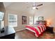 Cozy bedroom featuring natural lighting and an American flag tapestry on the wall at 3963 Harmattan Dr, Denver, NC 28037