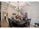 Elegant dining room with wainscoting, hardwood floors, and view of the staircase at 3963 Harmattan Dr, Denver, NC 28037