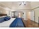 Comfortable main bedroom features an open sitting area, hardwood floors, and neutral paint at 3963 Harmattan Dr, Denver, NC 28037