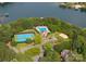 Stunning aerial view of the community pool, tennis courts and boat docks on Lake Norman at 4218 Ash Hollow Ln, Denver, NC 28037