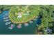 Aerial view of community pool and tennis courts near waterfront properties and boat docks at 4218 Ash Hollow Ln, Denver, NC 28037