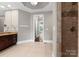 Well-lit bathroom with a vanity, walk-in shower, and tiled floors at 4218 Ash Hollow Ln, Denver, NC 28037