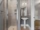 Neutral bathroom featuring a glass shower, pedestal sink, and modern fixtures at 4218 Ash Hollow Ln, Denver, NC 28037