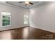 Spacious bedroom features hardwood floors, ceiling fan, and bright windows with natural light at 4218 Ash Hollow Ln, Denver, NC 28037