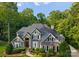 Beautiful two-story home with stone accents, dark shutters, and well-manicured landscaping at 4218 Ash Hollow Ln, Denver, NC 28037