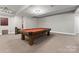 Spacious game room with a red felt pool table and neutral decor at 4218 Ash Hollow Ln, Denver, NC 28037