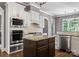 Gourmet kitchen with stainless steel appliances, a center island, and granite countertops at 4218 Ash Hollow Ln, Denver, NC 28037