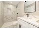 Stylish bathroom features a tiled shower-tub with modern fixtures and marble-look vanity at 446 Mint St, Rock Hill, SC 29730